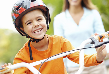 Sidebar image for page describing services provided by Chandler protective order attorney Joan Bundy. Shows mother and son on bike.
